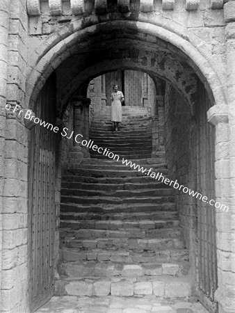 AT CASTLE RISING MRS TAYLOR'S AT DOORWAY